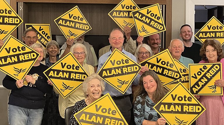 Alan Reid with his team